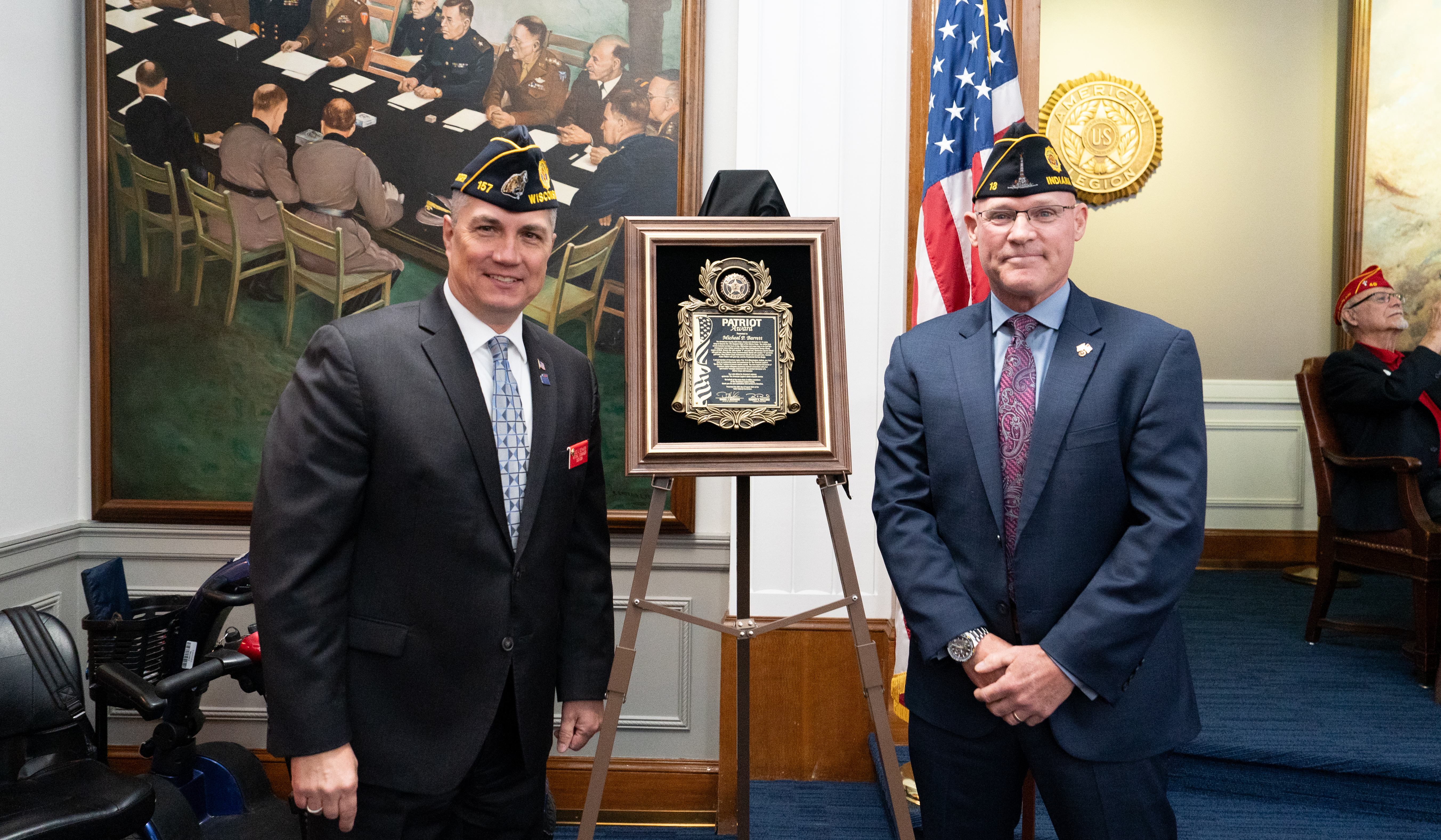 Past National Commander Daniel J. Seehafer awards retired Marine Sgt. Maj. Micheal P. Barrett with the Patriot Award. Photo by Hilary Ott /The American Legion