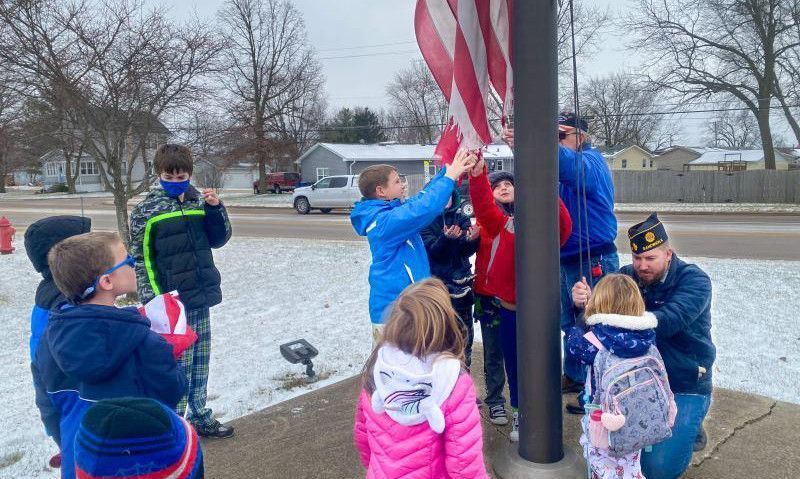 Preschooler helps teach classmates flag etiquette