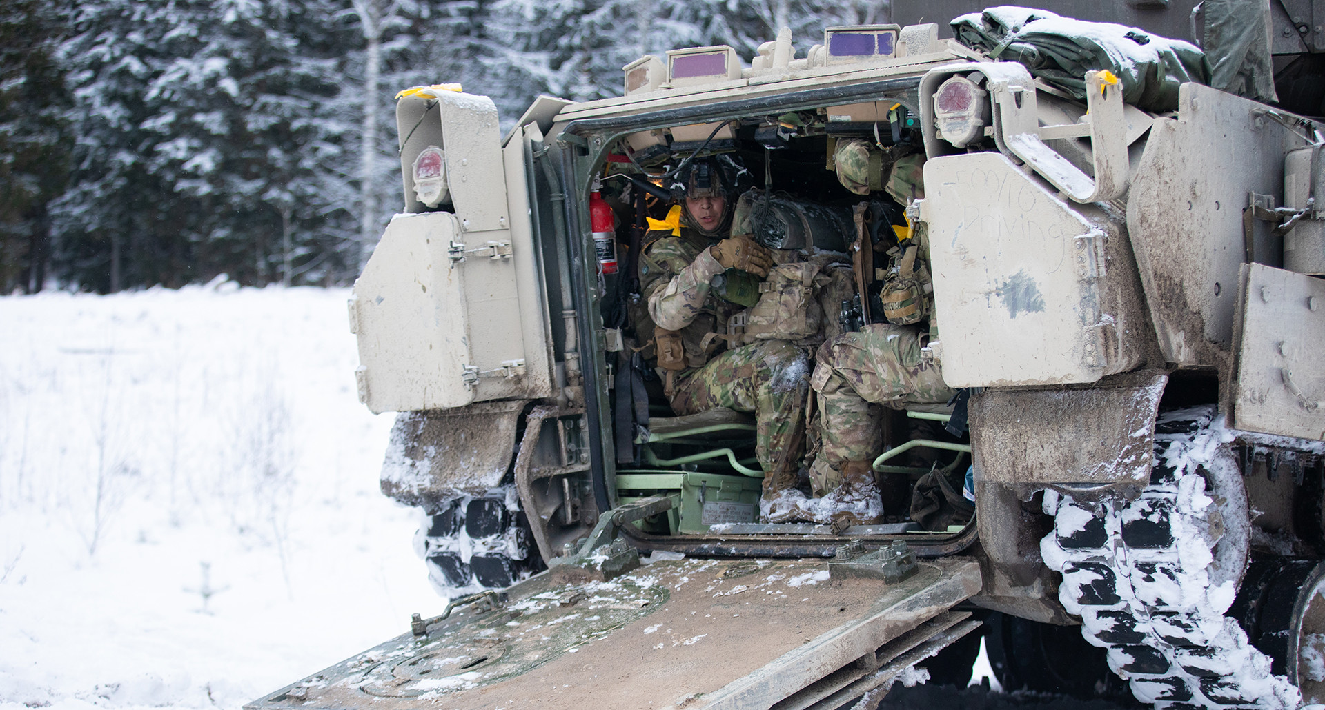 U.S. soldiers assigned to 3rd Infantry Division get inside a M2A4 Bradley during NATO’s training exercise ‘Winter Camp’ near Tapa, Estonia, Feb. 3. (U.S. Army photo by Pfc. Nathan Arellano Tlaczani)