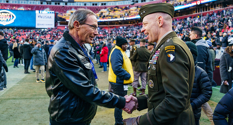 National Commander James LaCoursiere Jr. visits with a servicemember prior to the Army-Navy Game. (Photo by Jen Blohm)