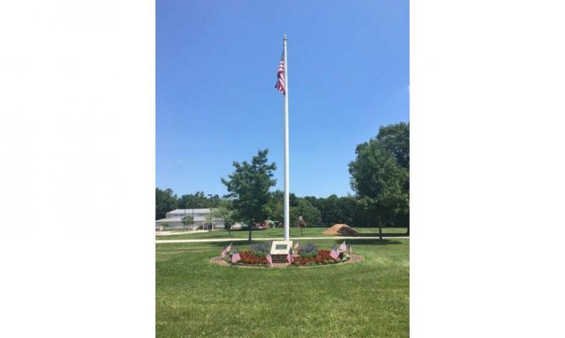 U.S. flag still waves from 1923 wood flagpole  