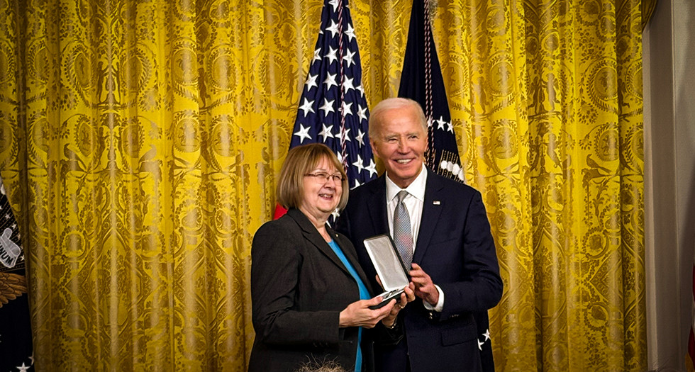 Past National Commander Denise Rohan accepts the Presidential Citizens Medal from President Biden on behalf of Diane Carlson Evans during a White House Ceremony on January 2, 2025. Photo by Mike Rohan