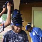 Shane Spencer stacks a rally-hat tower atop the head of teammate Trever Berg of Henderson, Nev., Post 40 during a 5-run 9th inning rally against Bryant, Ark., Post 298 during game 13 of The American Legion World Series on Monday, August 14, 2017 in Shelby, N.C.. Photo by Matt Roth/The American Legion. 