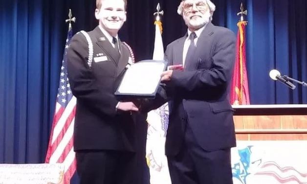 Francis Scott Key Post 11 Commander Keith Clevenger presents Navy JROTC medals to cadets 